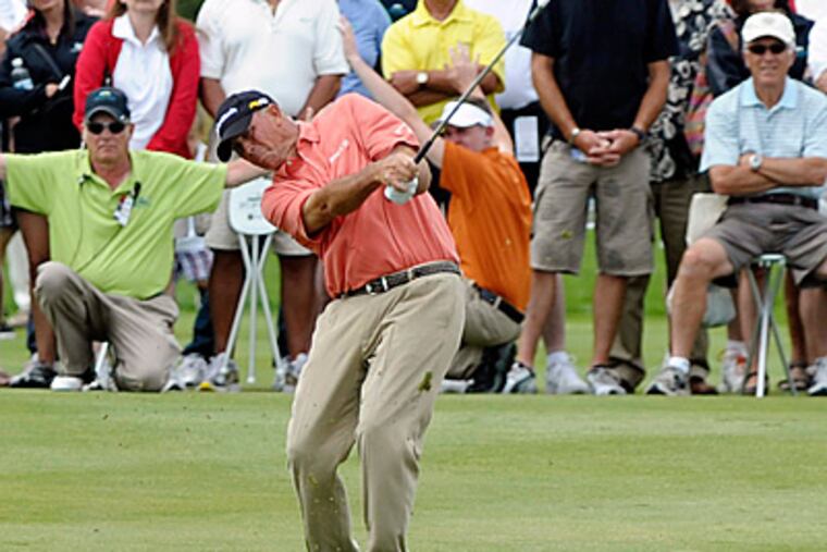 Tom Lehman hits the ball from the 18th fairway during third round of The Tradition golf tournament. (AP Photo/The Bulletin, Ryan Brennecke)