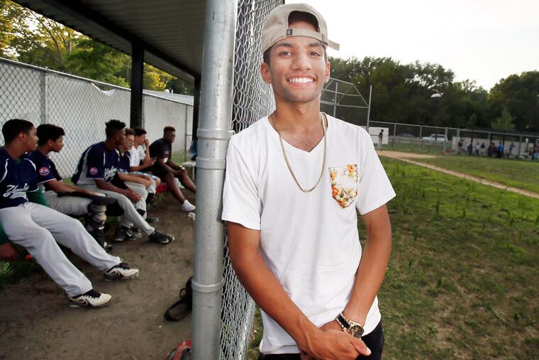 Argenis Calderon pauses while coaching his Yankees baseball team at Pyne Point Park in Camden on July 22, 2016.