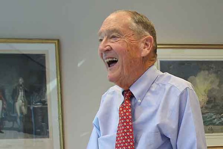 Jack Bogel shares a funny moment with his staff in his office in the Victory Building at Vanguard in Malvern. This is his desk and office. (Michael Bryant/Inquirer)