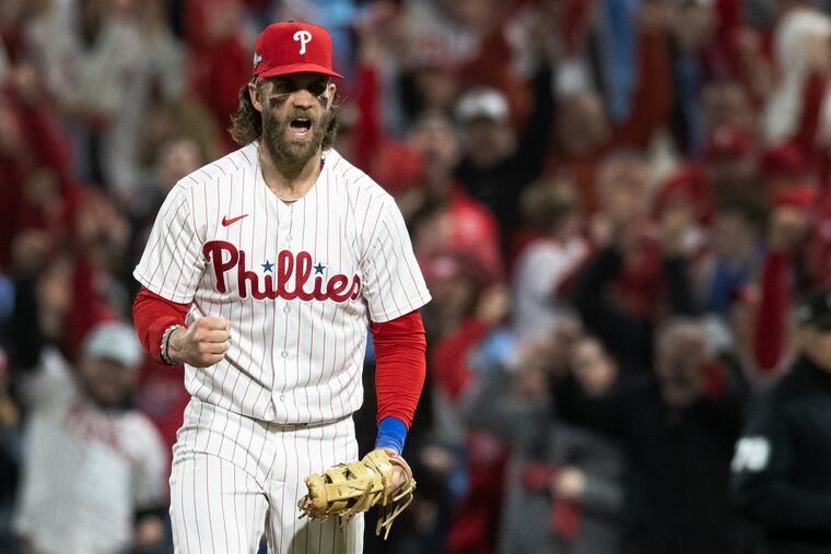 That's one: Phillies first baseman Bryce Harper celebrates the final out against the Arizona Diamondbacks in Game 1 of the NL Championship Series.