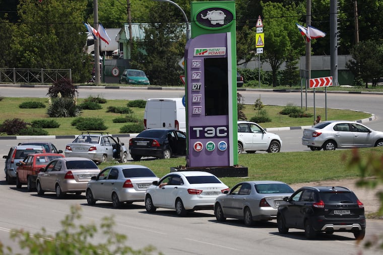 Cars line up at a petrol station in Simferopol, Crimea, Friday, June 12, 2026. Fuel sales to civilians have been restricted.