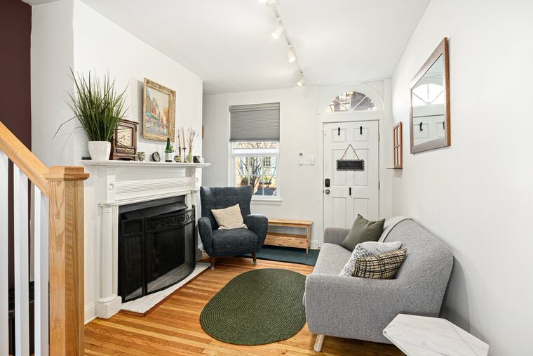 The living room of the expanded trinity in Queen Village.