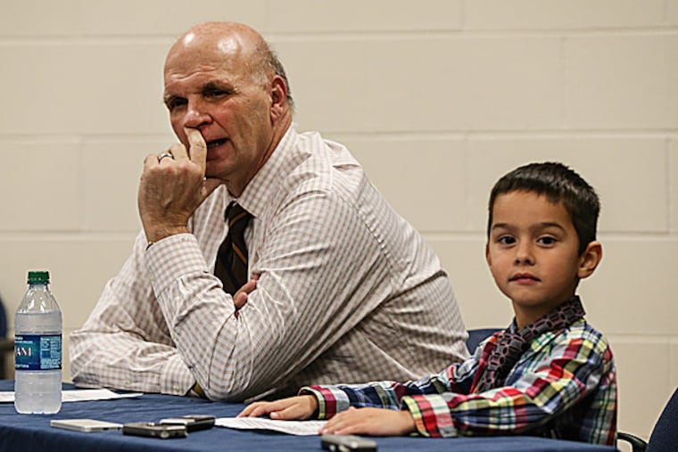 Saint Joseph's head coach Phil Martelli with his grandson. (Steven M. Falk/Staff Photographer)