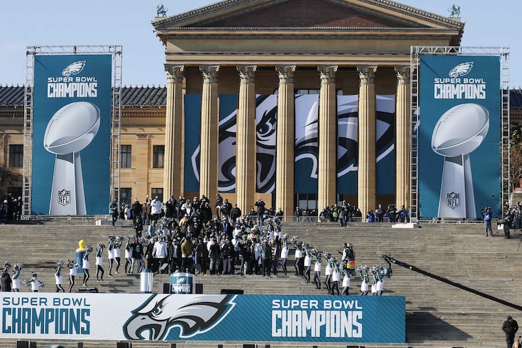 Members of the Eagles march down the steps of the Philadelphia Museum of Art during the Super Bowl LII victory celebration on Feb. 8, 2018.
