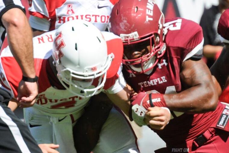 Temple's Abdul Smith forces a fumble on Houston quarterback John
O'Korn. (Ron Tarver/Staff Photographer)