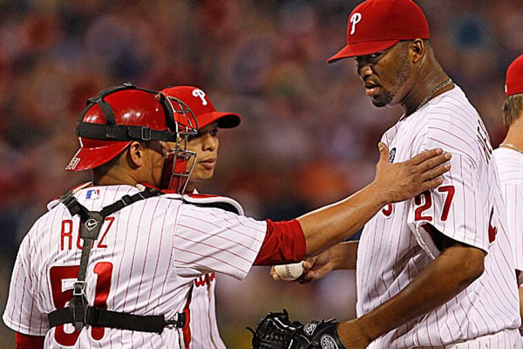 Phillies starting pitcher Roberto Hernandez and catcher Carlos Ruiz. (Ron Cortes/Staff Photographer)