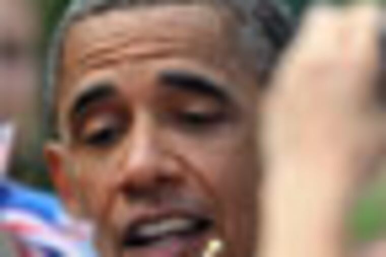 President Barack Obama takes a flag from Katelyn Maloy, 5, of Port Clinton, Ohio, after his speech at Washington Park in Sandusky, Ohio, Thursday, July 5, 2012. Obama is on a two-day bus trip through Ohio and Pennsylvania. (AP Photo/David Richard)