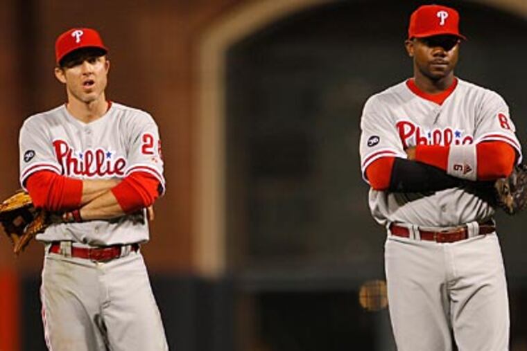 Chase Utley and Ryan Howard haven't provided the offense the Phillies are accustomed to. (Yong Kim / Staff Photographer)