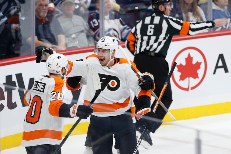Kieffer Bellows (20) and Rasmus Ristolainen (55) celebrate Bellows' in the second period.