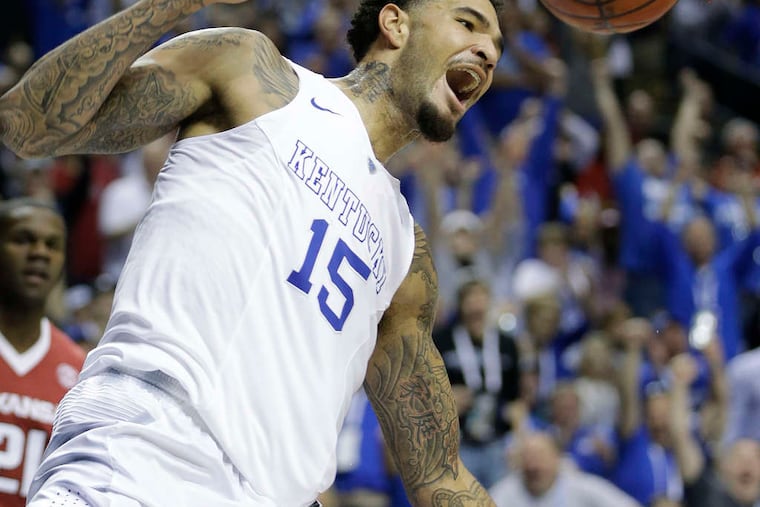 ASSOCIATED PRESS Kentucky's Willie Cauley-Stein celebrates dunk against Arkansas in SEC championship game.