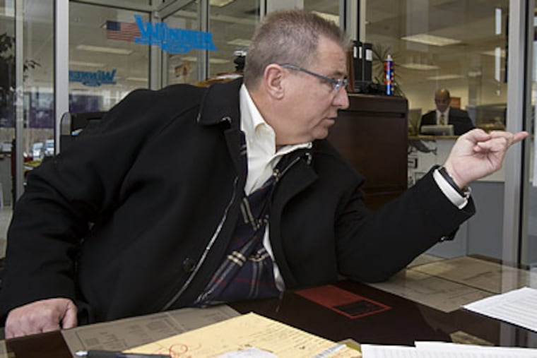 John A. Koninis of Wilmington, Del., says this is the time to buy a new truck. He traveled to Winner Ford in Cherry Hill to get one. (Ed Hille/Staff Photographer)