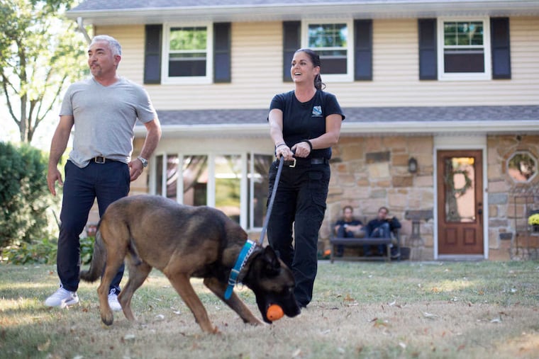 Cesar Millan, "Dog Whisperer", and Carol Skaziak, stand outside Skaziak\'s home in Huntingdon Valley.