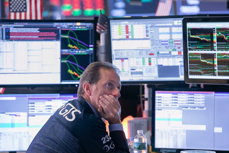 Glenn Carrel works at his post on the floor of the New York Stock Exchange. A sharp dip in bond yields shine a brighter spotlight on some of the S&P 500’s best dividend deals as investors face an increasingly volatile market amid trade wars and economic growth concerns.