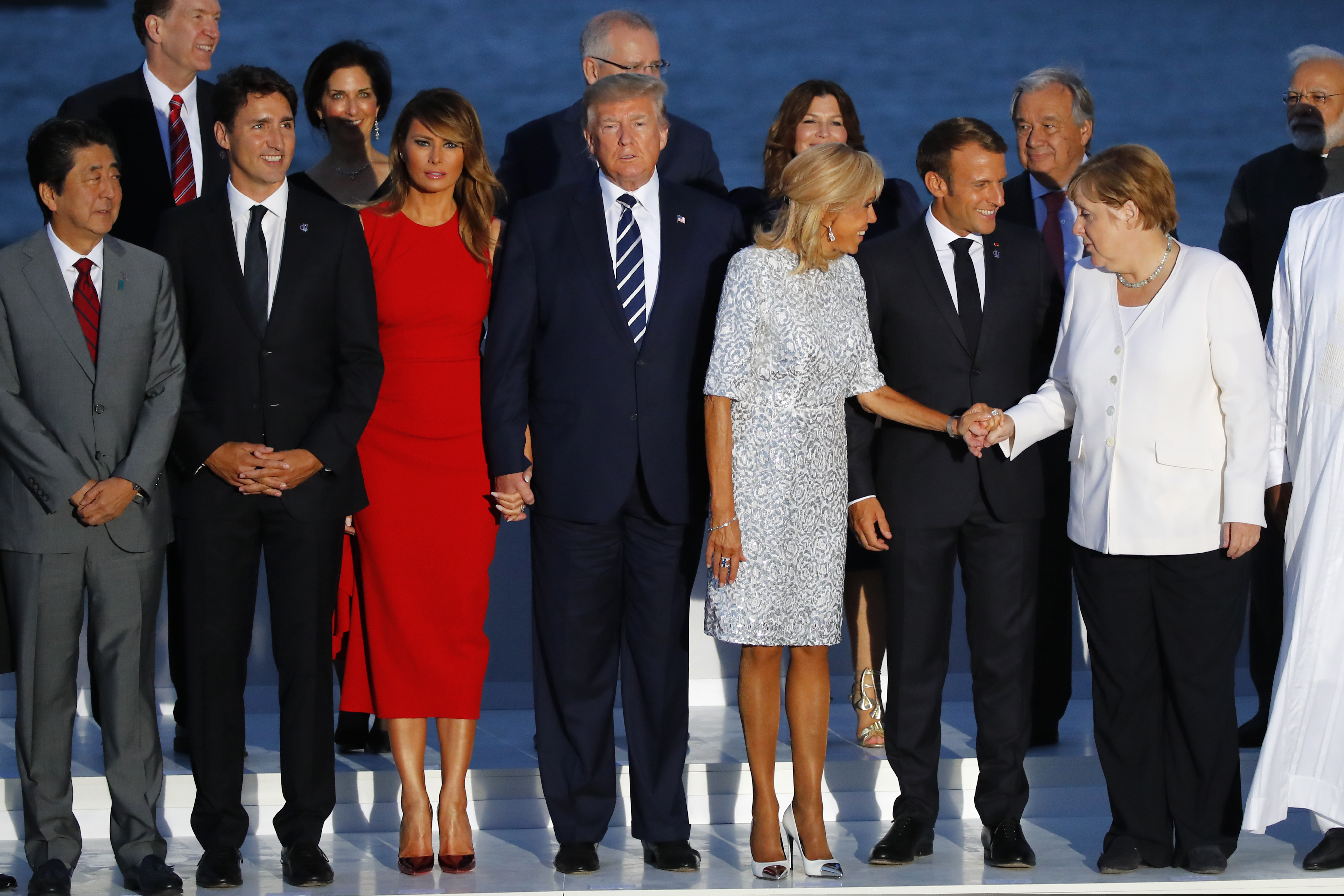 (From left) Japanese Prime Minister Shinzo Abe, Canadian Prime Minister Justin Trudeau, first lady Melania Trump, President Donald Trump, Brigitte Macron, French President Emmanuel Macron, and German Chancellor Angela Merkel during the G-7 summit on Sunday.