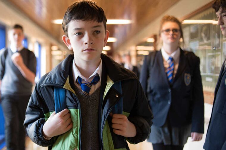 Lewis MacDougall (left) stars as Conor in A MONSTER CALLS. (Photo Credit : Jose Haro / Focus Features)