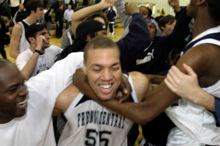Friends' Central Dominic Morris is in the midst of a celebration after the Phoenix clinched the Pennsylvania Independent Schools tourney title, beating Germantown Academy, 60-58.