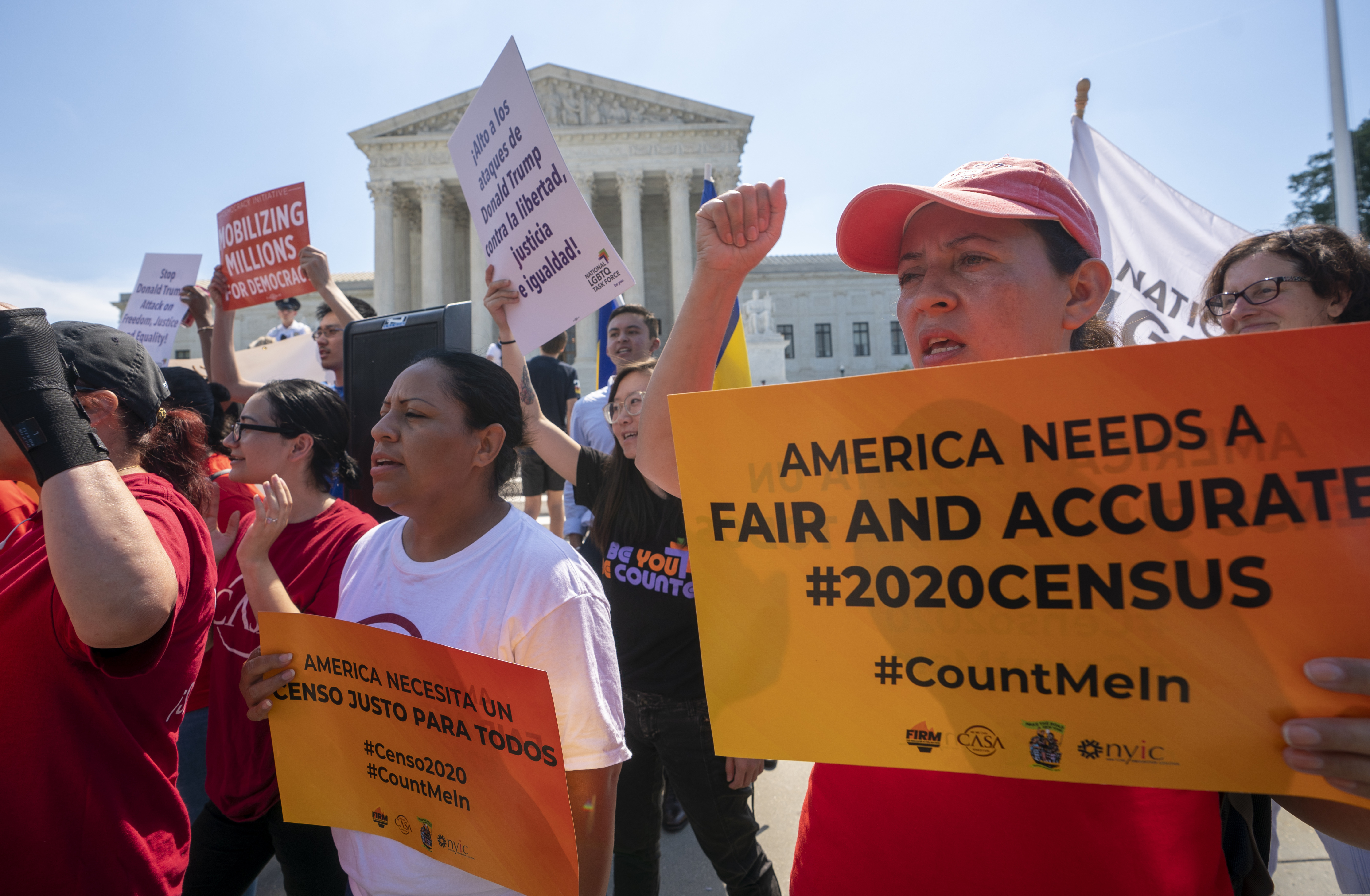 FILE - In this June 27, 2019, file photo, demonstrators gather at the Supreme Court as the justices finish the term with key decisions on gerrymandering and a census case involving an attempt by the Trump administration to ask everyone about citizenship status in the 2020 census, on Capitol Hill in Washington. The Justice Department said Tuesday that the 2020 Census is moving ahead without a question about citizenship.