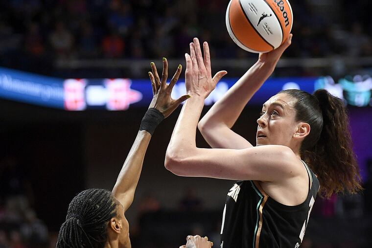 The New York Liberty's Breanna Stewart shoots above the Connecticut Sun's DeWanna Bonner earlier this season.