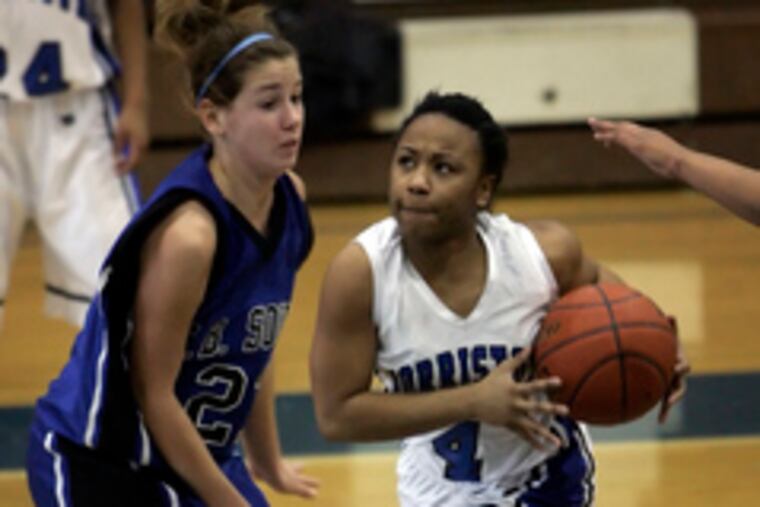 Norristown's Raevon Mitchell , who scored four points, looks determined as she drives past C.B. South's Calla Miller.