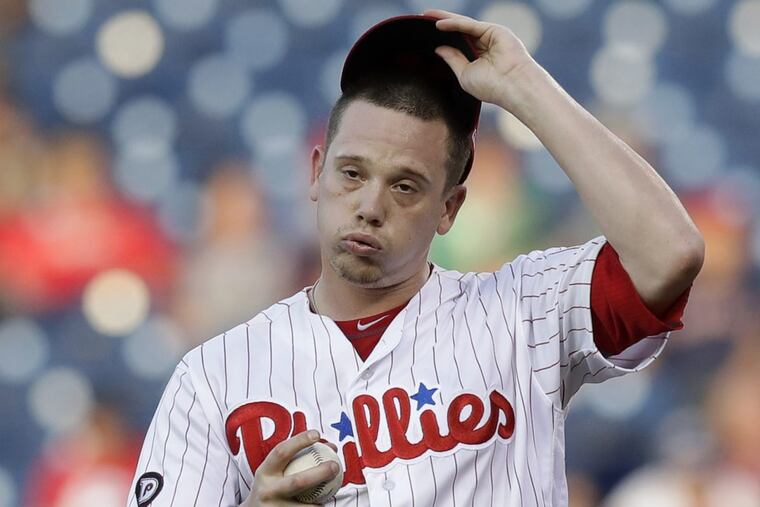 Phillies pitcher Jeremy Hellickson reacts after giving up an RBI double to Boston’s Mookie Betts in the second inning on Wednesday.
