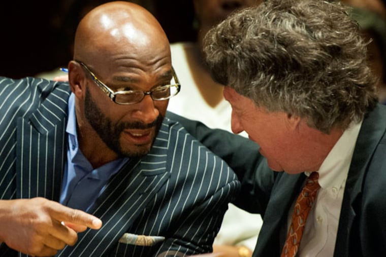 Former Eagles wide receiver Irving Fryar and his lawyer Michael Gilberti in the courtroom at the Burlington County Courthouse on Tuesday. Fryar last year rejected a plea agreement that would have required him to admit guilt in exchange for a 5-year term. (CLEM MURRAY / Staff Photographer)
