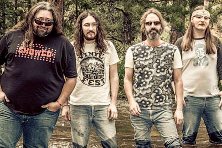 The Hard Working Americans: Dave Schools, Jesse Aycock, Neal Casal, Duane Trucks; The band's name seeks to broaden the definition of who is considered patriotic. (JAY BLAKESBERG)