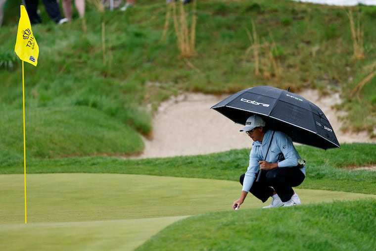Rickie Fowler lines up a birdie putt on the par-3 16th hole during Friday's second round.