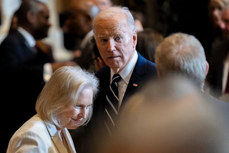 Sen. Kirsten Gillibrand, D-N.Y., left, speaks to President Joe Biden following the National Prayer Breakfast on Capitol Hill in Washington on Thursday.