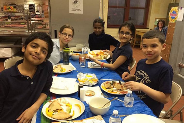 Krish Patel, Amy Czerobski, Benila Reji, Krina Patel, and Joel Muniz enjoying their quesadillas and potato strips at Loesche. (Photo by Susan Munafo)