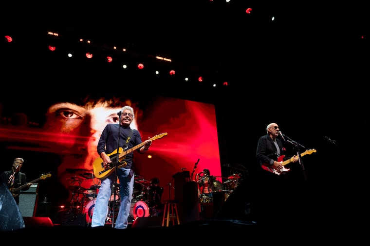 The Who band members Roger Daltrey (left) and Pete Townshend (right) perform Wednesday at Xfinity Mobile Arena during their North American Farewell Tour.