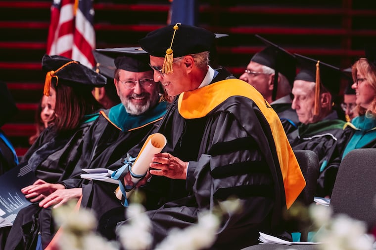 A newly hooded honorary doctor Andrea Bocelli with Ignazio R. Marino, executive director of the Jefferson Italy Center, at the university's 199th commencement on Wednesday.