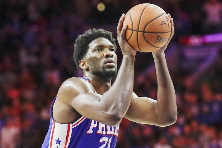 Sixers center Joel Embiid shoots a free throw against the Pacers on Nov. 3.