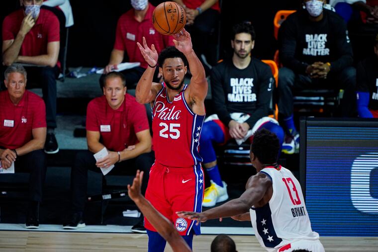 Philadelphia 76ers guard Ben Simmons (25) shoots over Washington Wizards center Thomas Bryant (13) during the second half of the game.