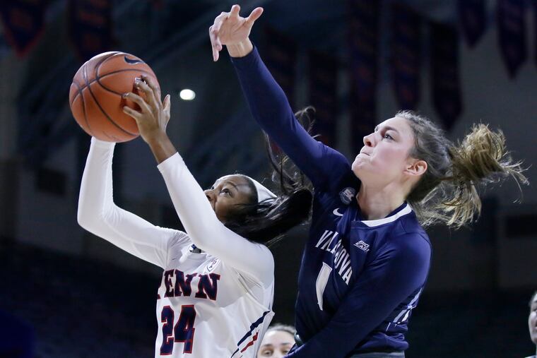 Penn's Tori Crawford and Villanova's Bridget Herlihy go for a rebound during their Big 5 matchup on Jan. 16.