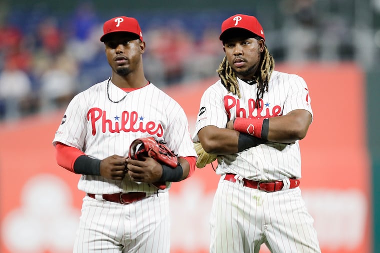 Maikel Franco, right, wasn't in the Phillies' lineup Tuesday night after not running hard on a grounder in Monday night's loss to the Dodgers. After similar incidents of not hustling last month, Jean Segura, left, wasn't removed from the lineup.