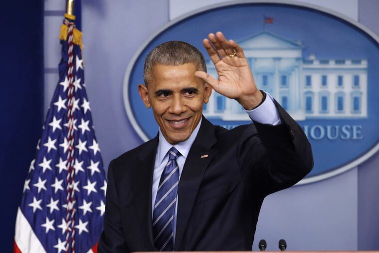 President Barack Obama waves at the conclusion of a news conference in the White House in December.