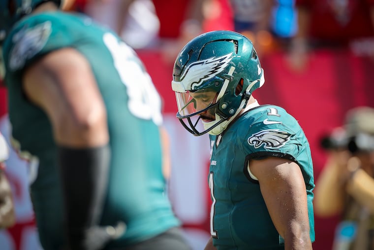 Eagles quarterback Jalen Hurts disappointingly walks back to the Eagles’ sideline in the fourth quarter against the Tampa Bay Buccaneers.