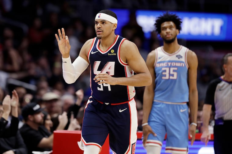 Tobias Harris holds up three fingers after hitting a three-point basket against Sacramento.