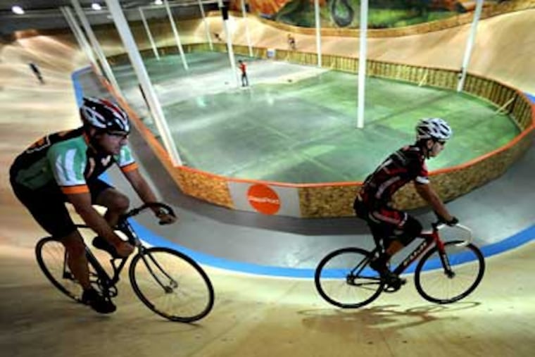 At the Boulder Indoor Cycling in Colorado, Scott Key (left) of Arvada, Colo., follows Paul Wells during a velodrome riding class. The 142-meter velodrome has been open for a month. (Cliff Grassmick / The (Boulder, Colo.) Camera)