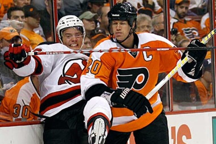 Flyers defenseman Chris Pronger checks the the Devils' Jacob Josefson in the third period. (Yong Kim/Staff Photographer)