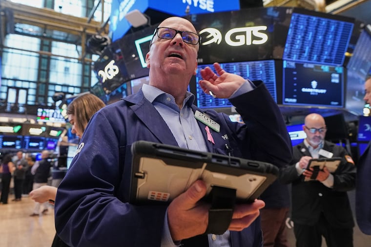 Trader Patrick Casey works on the floor of the New York Stock Exchange, Wednesday, May 13, 2026.