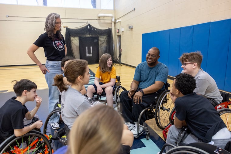 Coach Chris Noel, of Manhattan, N.Y., chats with his players during practice at the Pelbano Gymnasium in Philadelphia, Pa., on Saturday., March. 14, 2026.