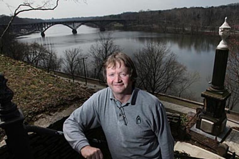 Long overgrown and obscured, Laurel Hill Cemetery, overlooking Kelly Drive and the Schuylkill, has been transformed, thanks to superintendent Bill Doran and crew. (LAURENCE KESTERSON / Staff Photographer)