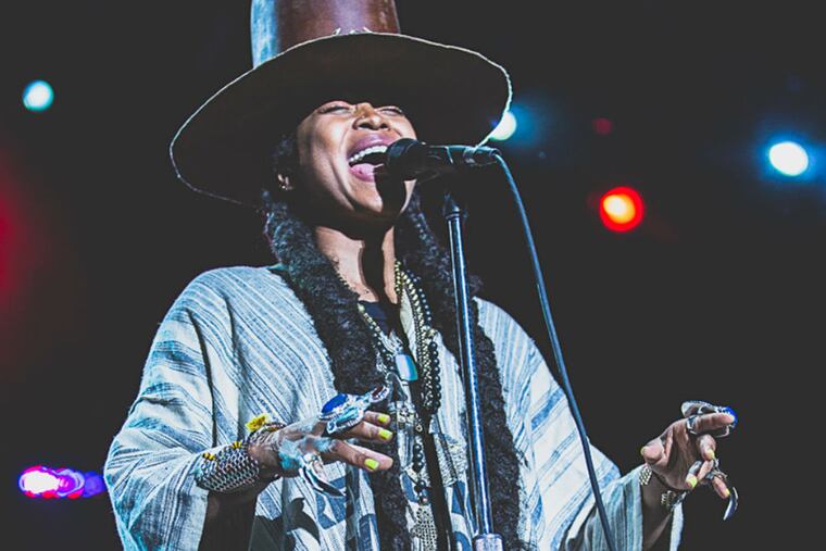 Erykah Badu performs at the Dell Music Center on Friday, August 14, 2015. The show was a "make-up" performance, since travel difficulties had prevented Badu from performing the day before.