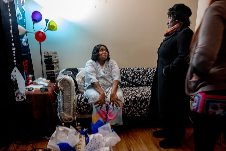 Pennsylvania House Speaker Joanna McClinton (center) and home care worker Kate McNaughton (right) meet with home care recipient Sheila Alexander on Jan. 20 in her West Philadelphia home.