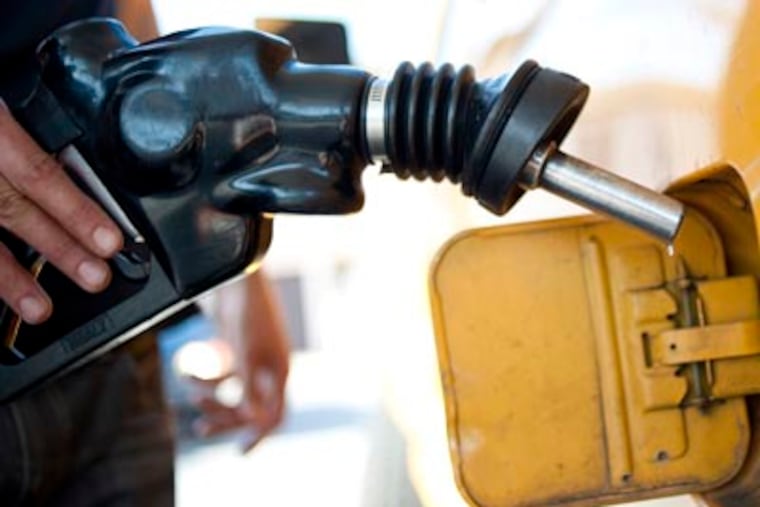 A man pumps gas into his dual-tank pickup truck at a 76 gas station in Los Angeles, Friday, Aug. 10, 2012. Analysts expect gas prices to rise above $4 a gallon due to a fire at the Richmond, Calif., refinery on Aug. 6, 2012. (AP Photo/Grant Hindsley)