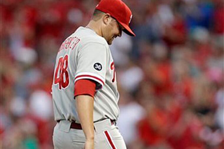 Andrew Carpenter kicks at the mound after giving up a two-run home run. (AP Photo/Jeff Roberson)