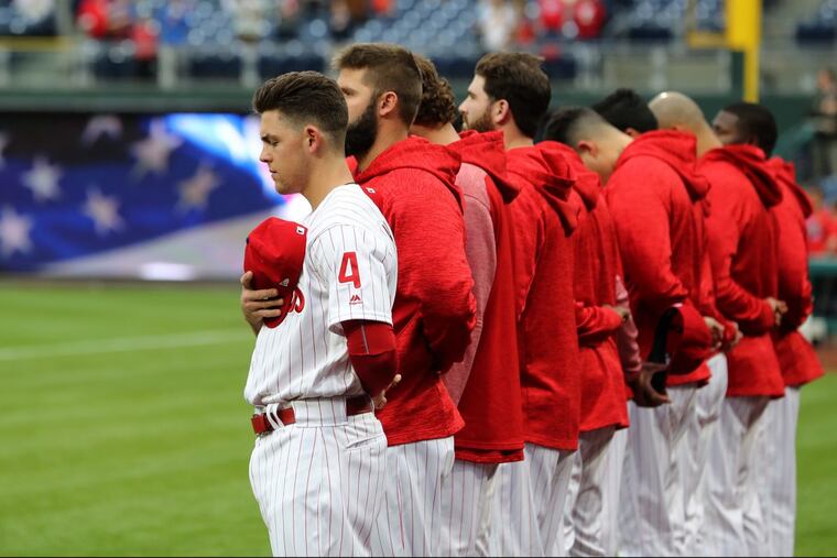 Scott Kingery, left, already has played six positions in his brief major-league career.