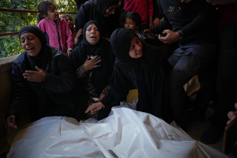 Mourners attend the funeral of Palestinians killed in an Israeli military strike, at Nasser Hospital in Khan Younis, Gaza Strip, Dec. 4.