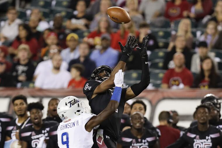 Temple wide receiver Ventell Bryant attempts to catch the football against Tulsa cornerback Reggie Robinson II during the second-quarter on Thursday, September 20, 2018 in Philadelphia. YONG KIM / Staff Photographer
